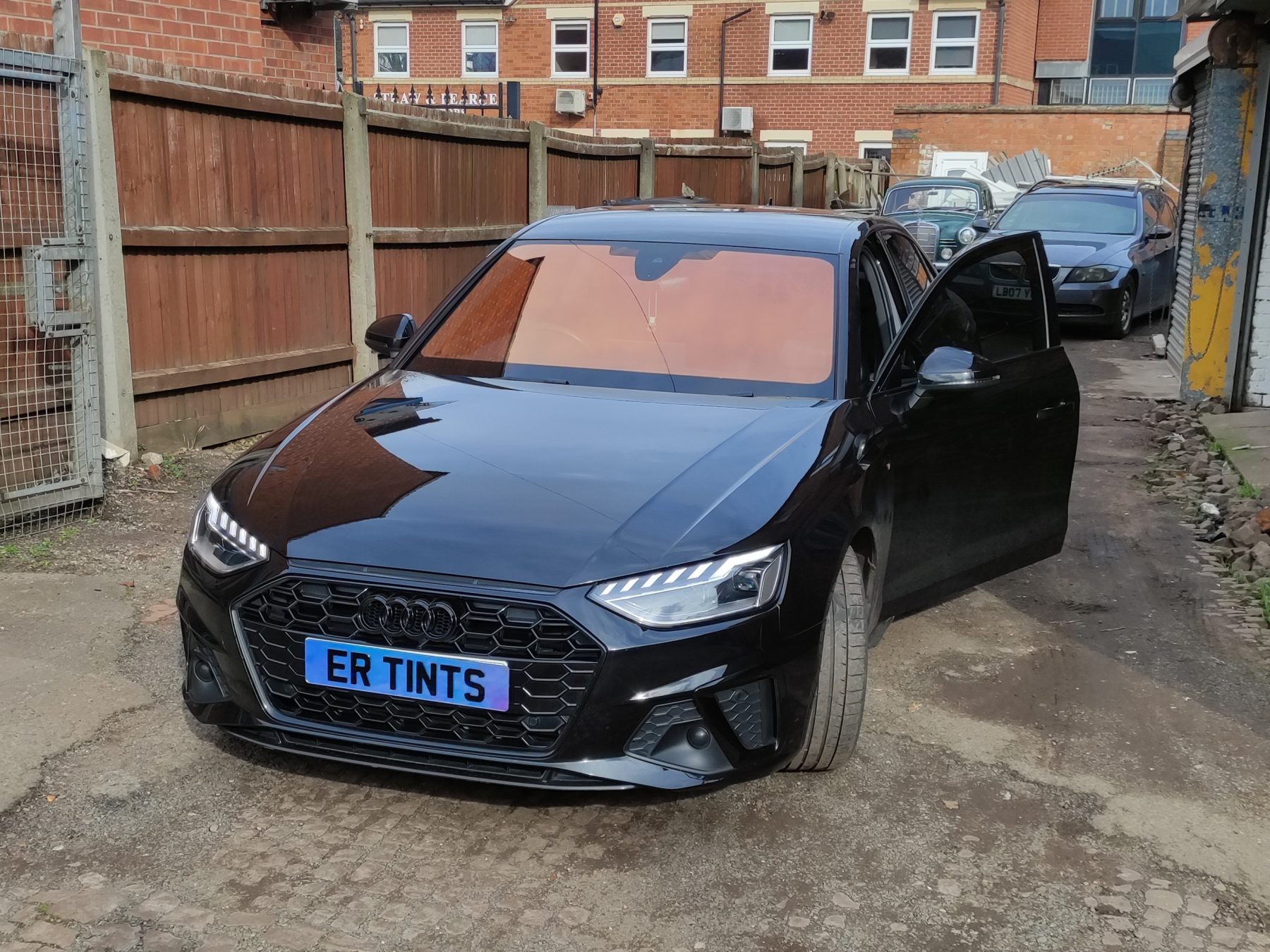 Chameleon Tinting Black audi a4 fitted with a bright orange chameleon windscreen