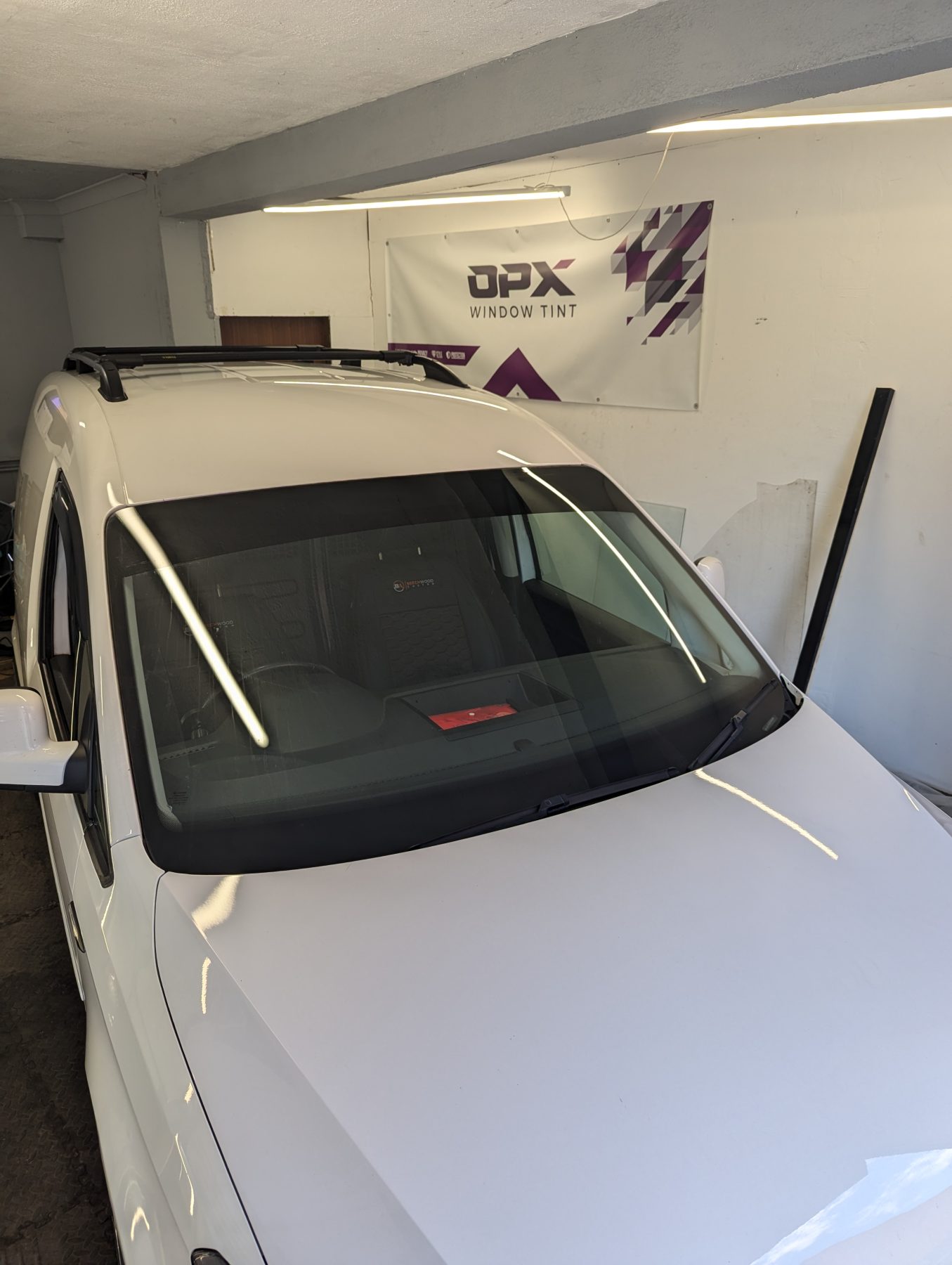 Window Tinting front windscreen with tinted sunstrip