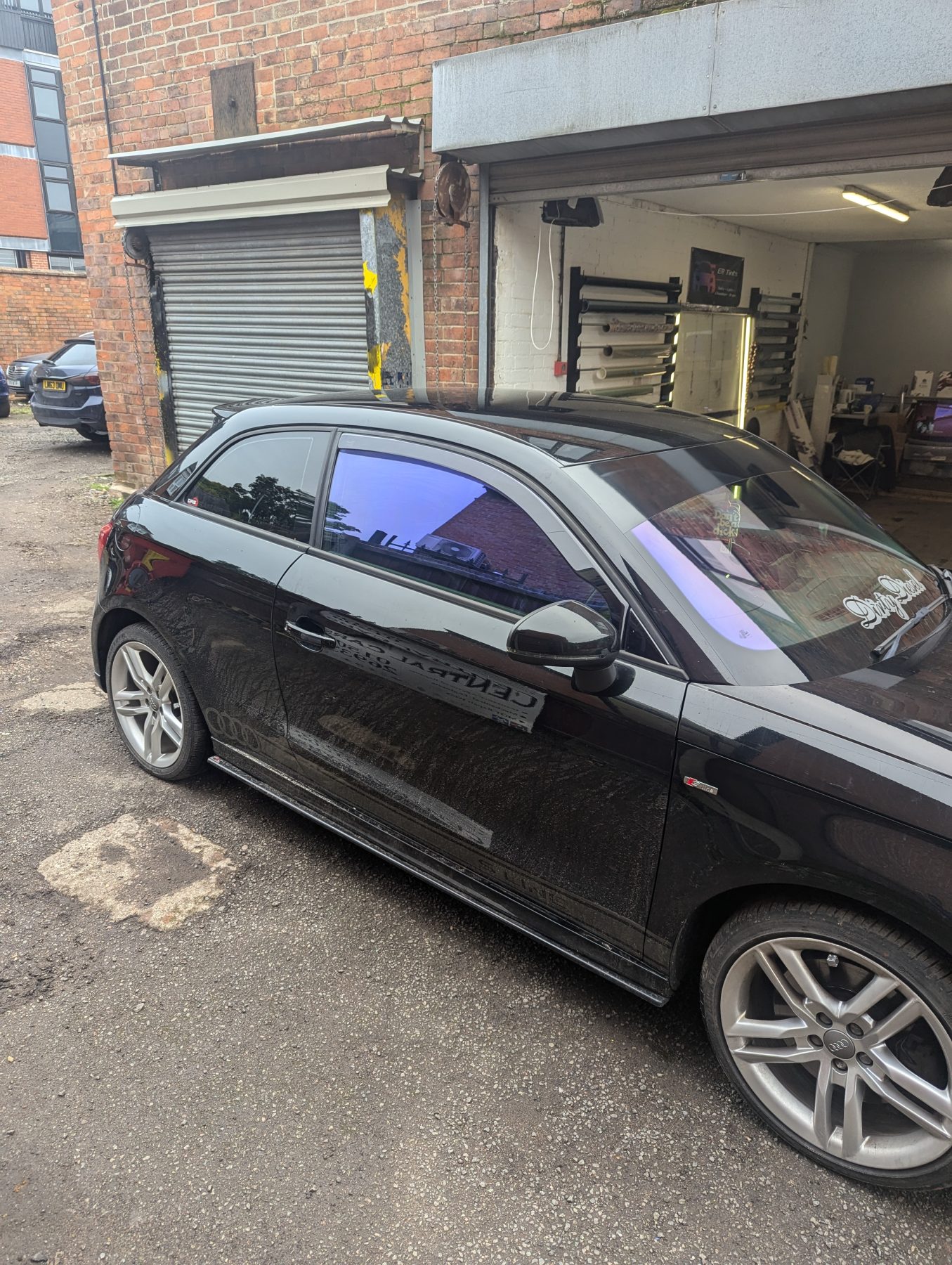 Window Tinting car front passenger window with blue chameleon tinted to the legal limit