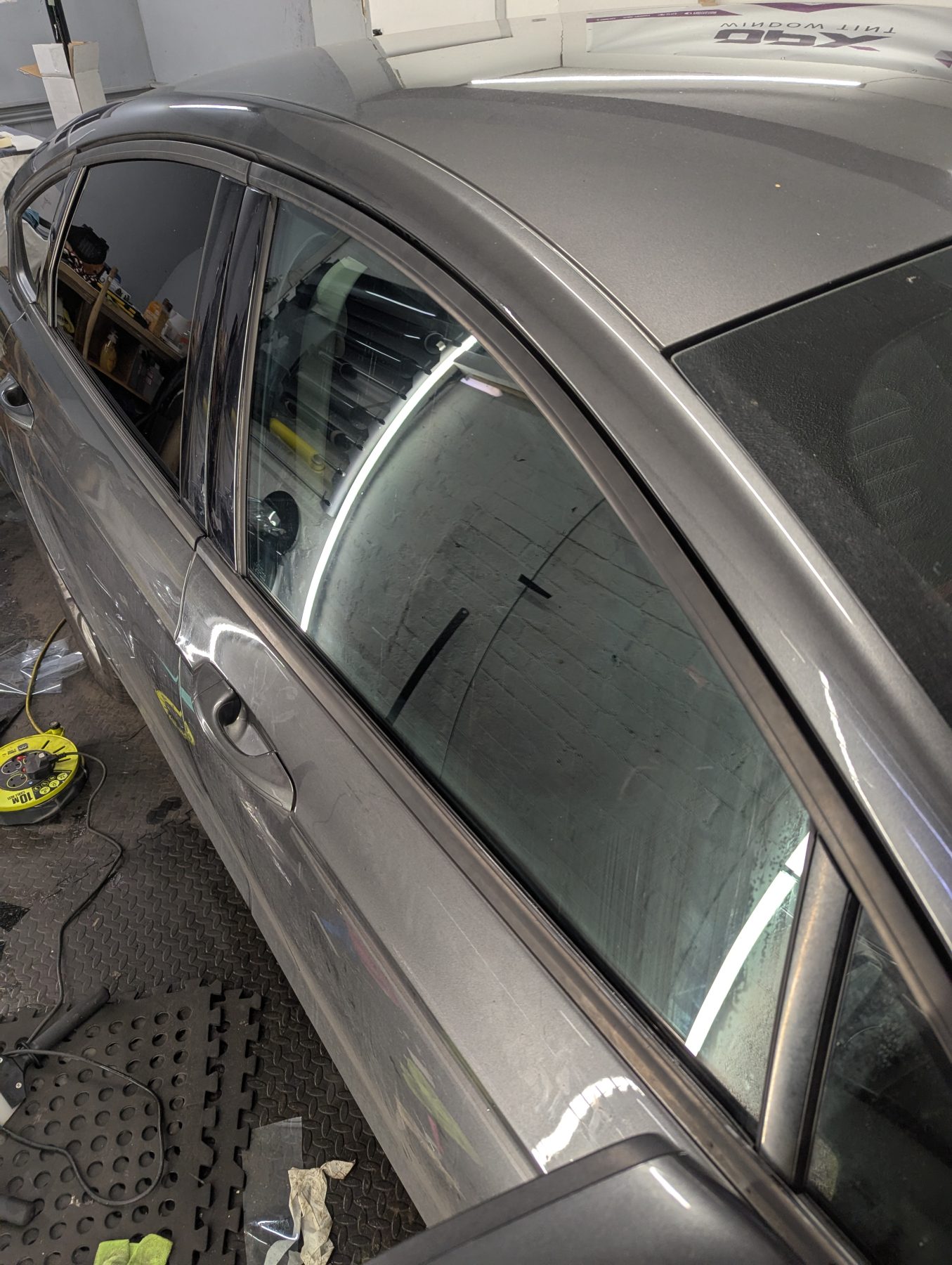 Window Tinting car front passenger window tinted to the legal limit