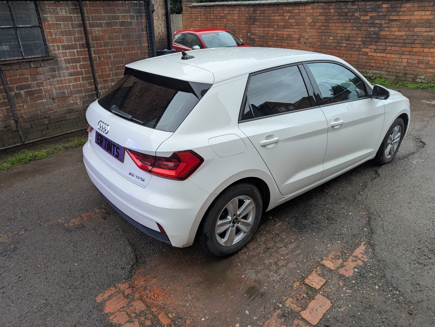 Window Tinting White audi a1 with 20% dark smoke tinted rear windows