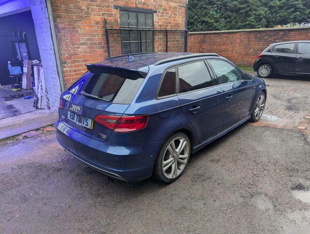 Blue audi a3 with 5% limo tinted rear windows