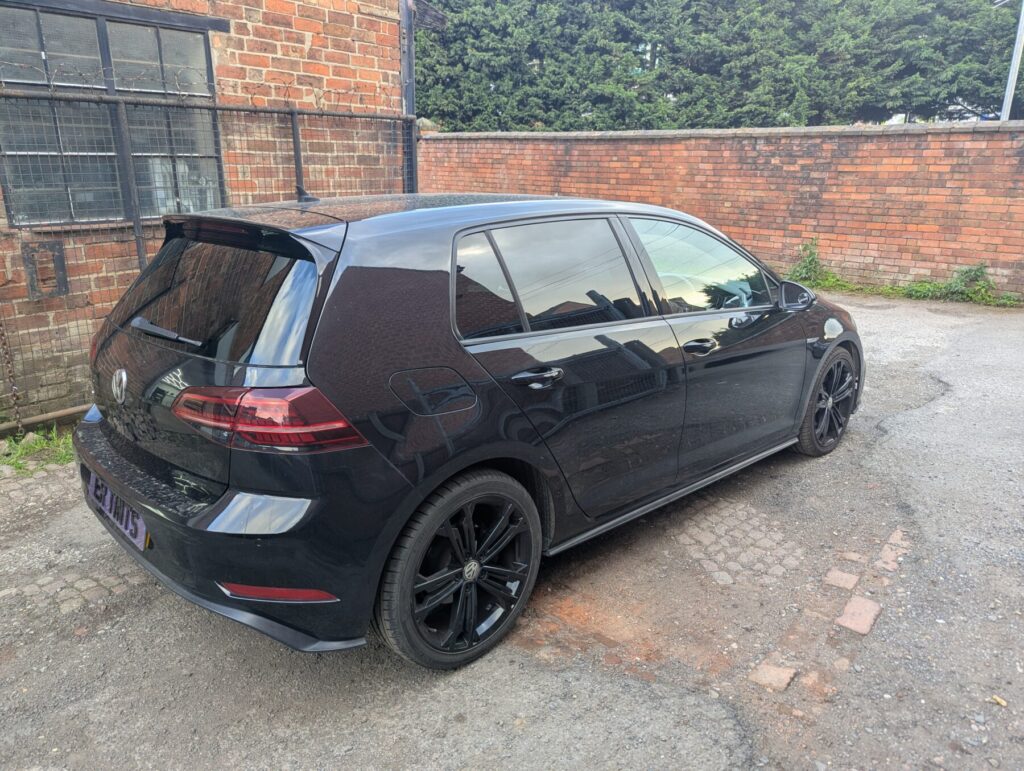 Black volkswagen golf with 5% limo tinted rear windows