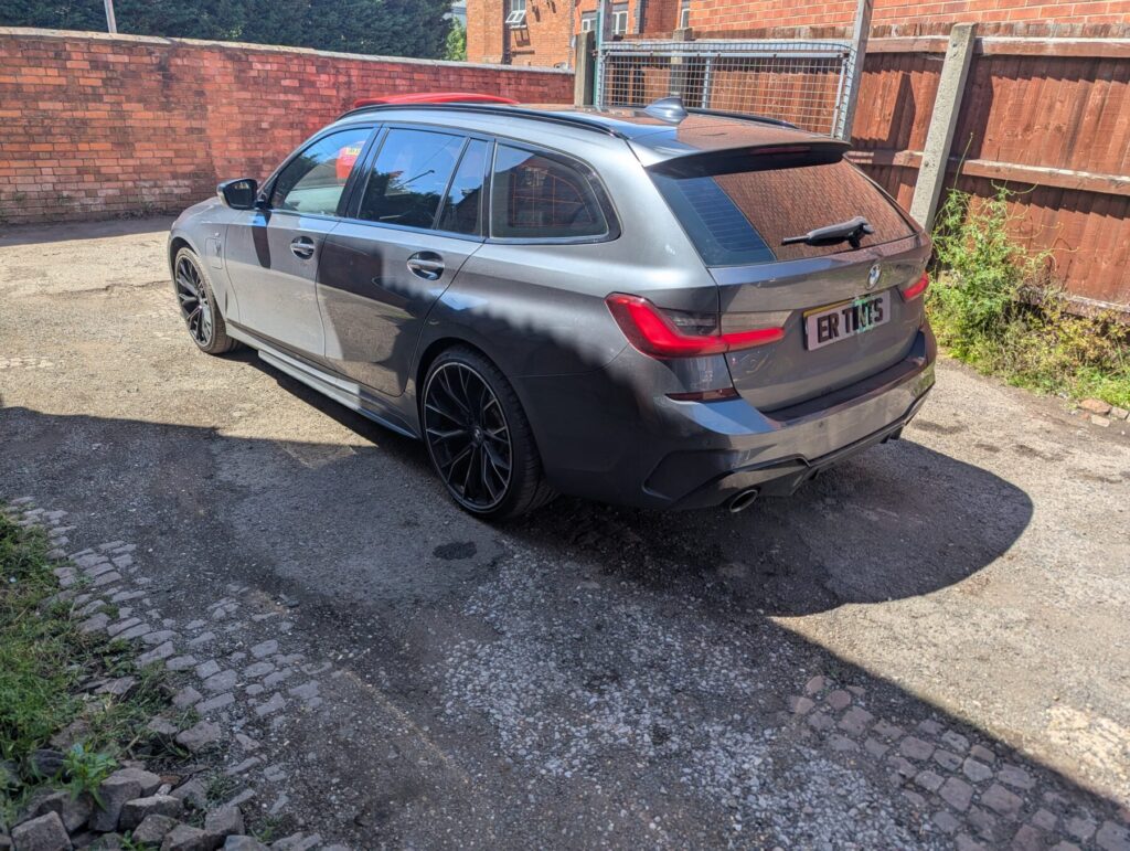 Grey bmw 330e with 20% dark smoke tinted rear windows