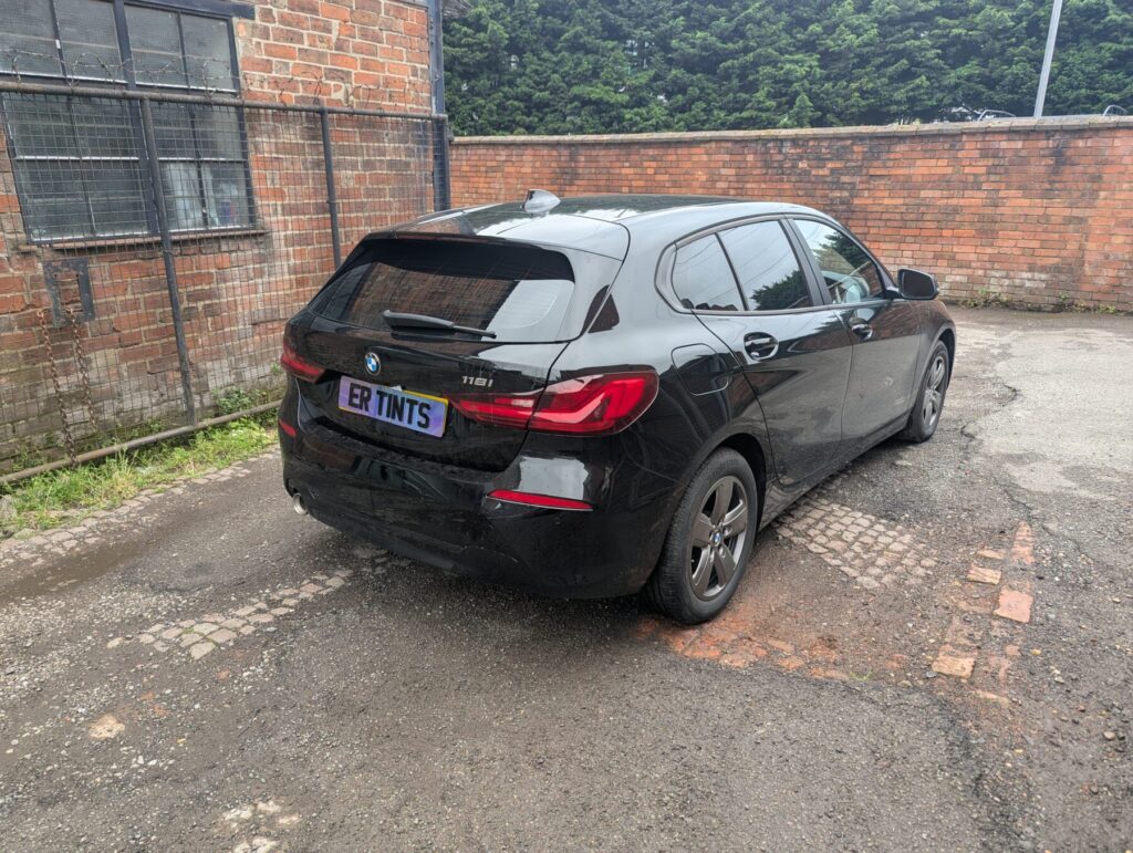 Black bmw 1 series with 5% limo tinted rear windows