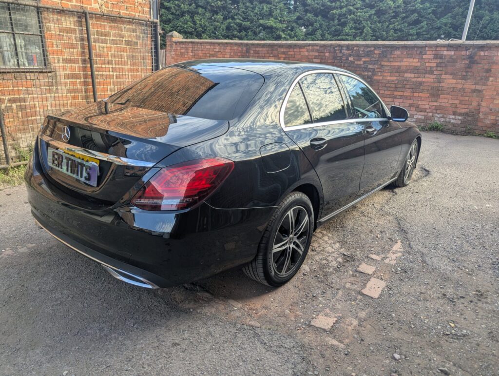 Black mercedes c220 with 5% limo tinted rear windows