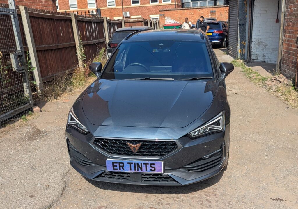 grey cupra leon fitted with a blue chameleon windscreen