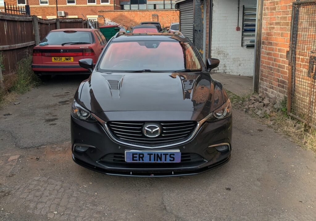 a grey mazda 6 with a red blue widscreen