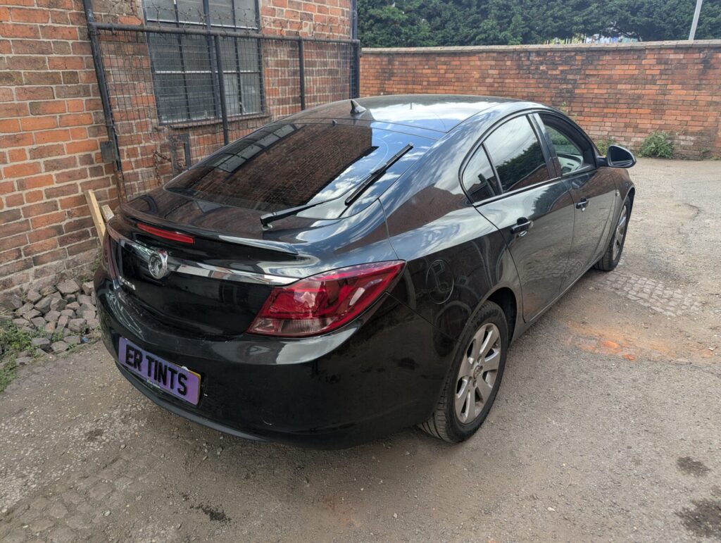Black vauxhall insignia with 5% limo tinted rear windows and medium smoked ppf taillights