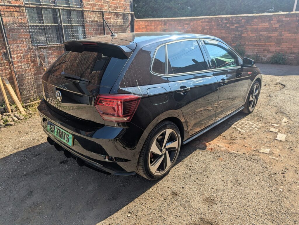 Black volkswagen polo with 5% limo tinted rear windows