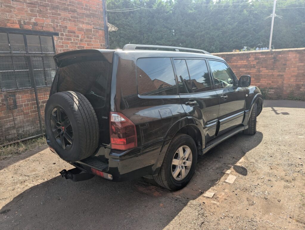 Black mitsubishi shogun with 5% limo tinted rear windows