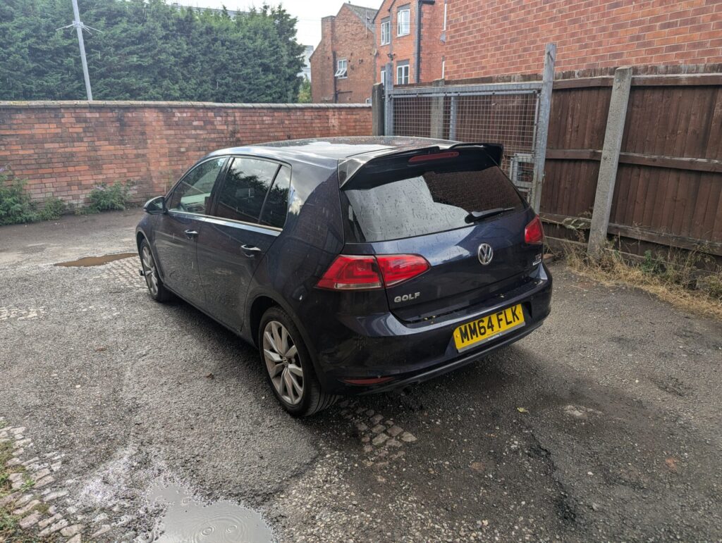 Dark blue Volkswagen golf with 5% limo tinted rear windows